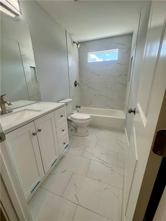 3700 Hudson Court Rex, GA 30273 - Photo 11 of 28 a bathroom with a double vanity sink toilet and shower