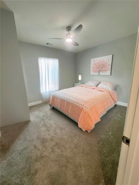 3700 Hudson Court Rex, GA 30273 - Photo 12 of 28 a bed sitting in a bedroom next to a window