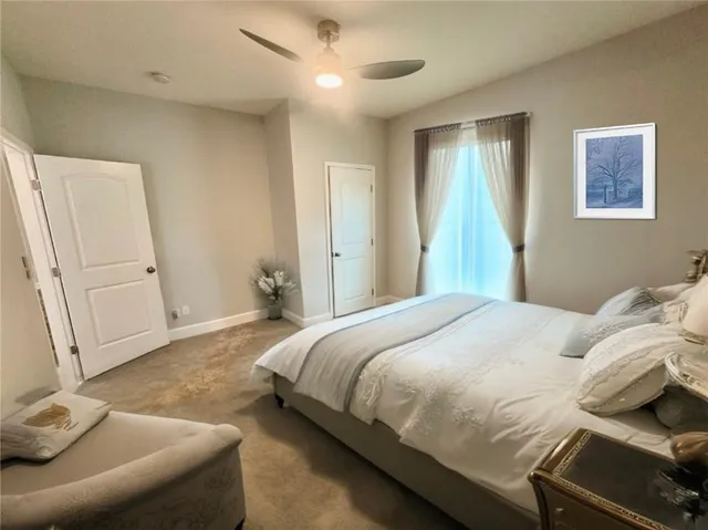 a bedroom with a bed and a couch