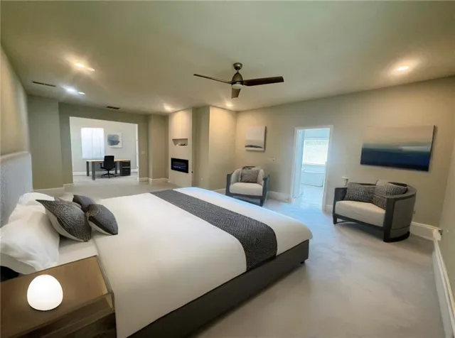 a bedroom with a bed and glass window