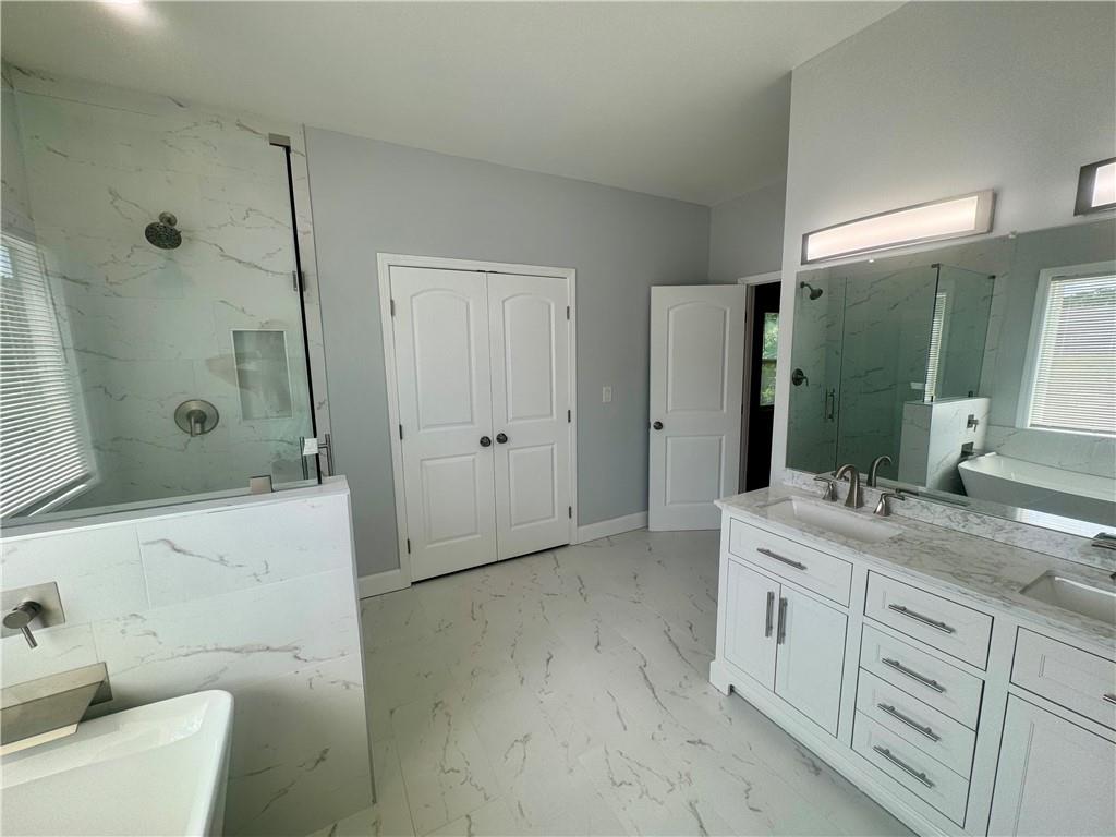 3700 Hudson Court Rex, GA 30273 - Photo 22 of 28 a bathroom with a granite countertop sink a toilet and shower