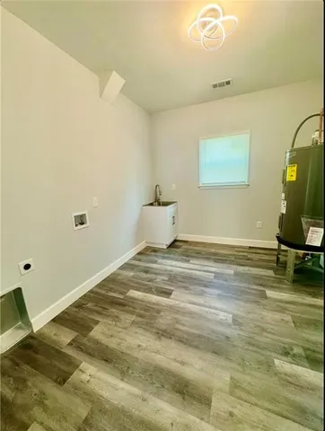 a view of a room with wooden floor