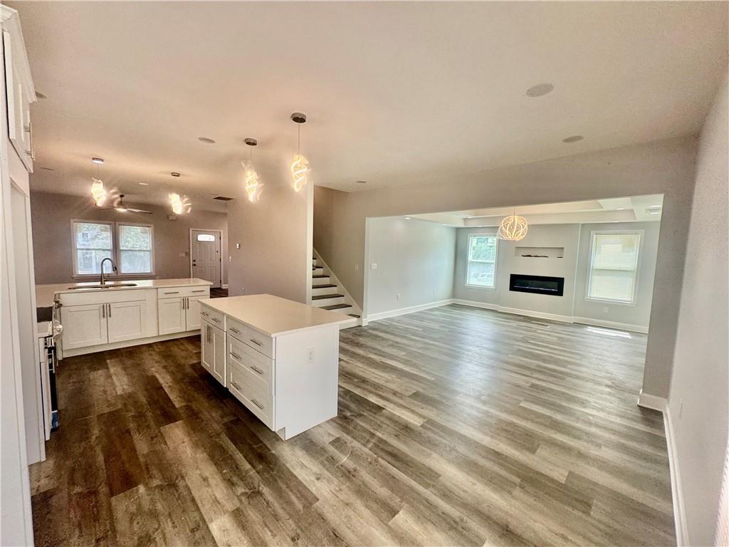 3700 Hudson Court Rex, GA 30273 - Photo 8 of 28 a large white room with kitchen island in the center