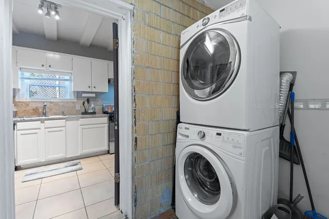 a view of a kitchen with washer and dryer