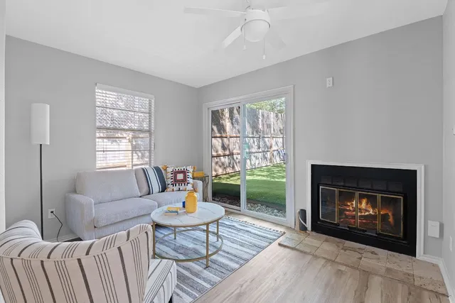 a living room with furniture and a fireplace