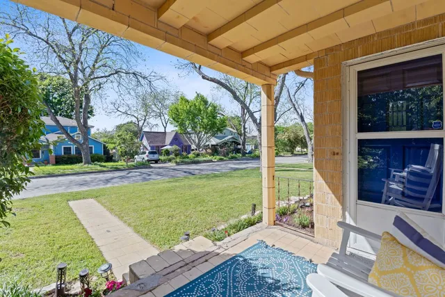 a view of a two chairs in the patio
