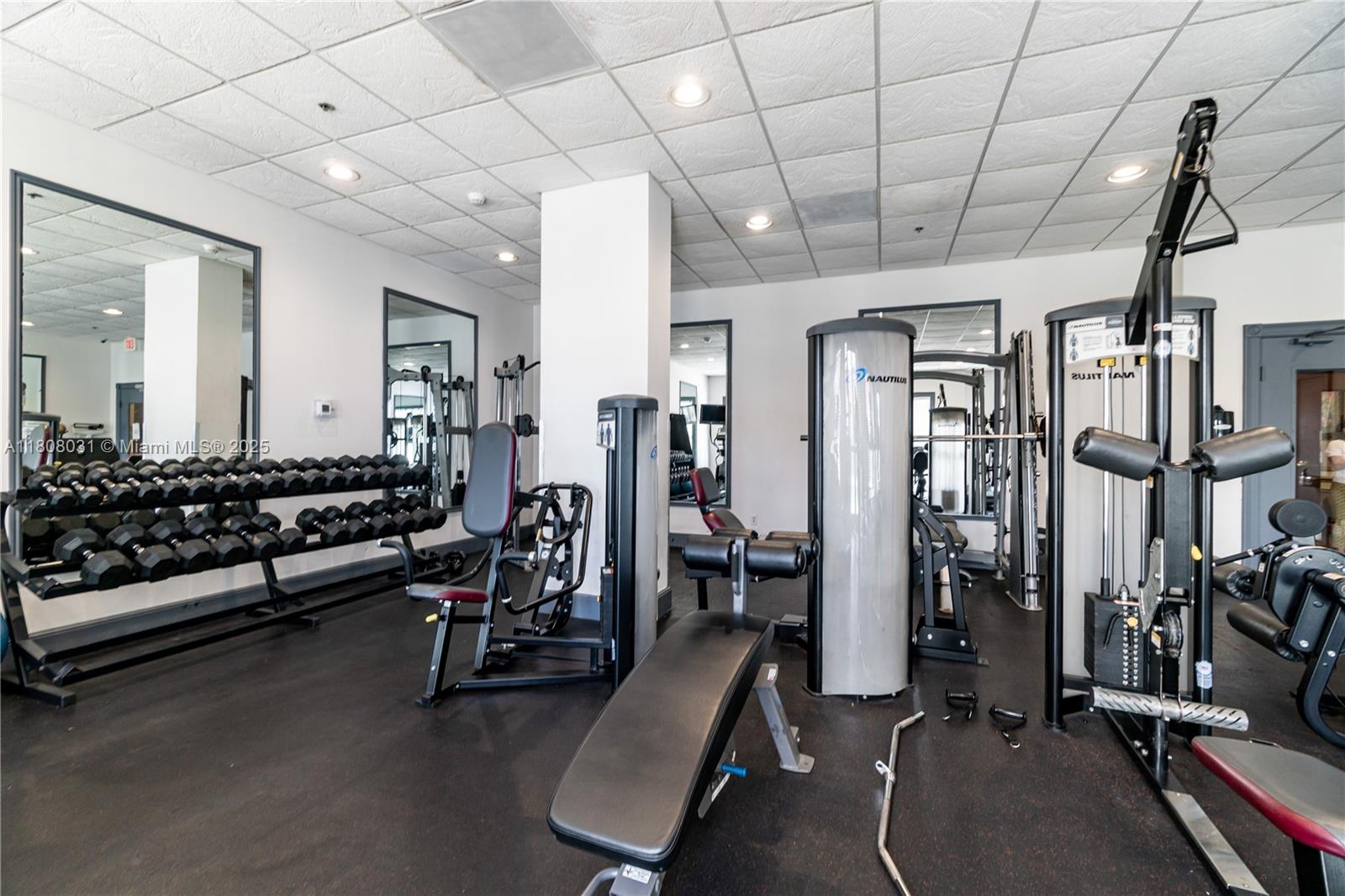 2665 Southwest 37th Avenue, Unit 906 Miami, FL 33133 - Photo 22 of 35 a view of a room with gym equipment
