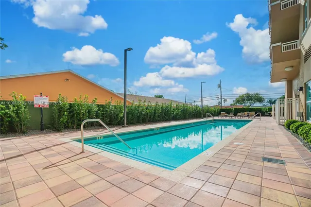a view of a swimming pool with a patio