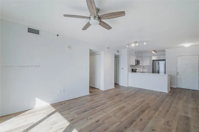 a view of kitchen with wooden floor