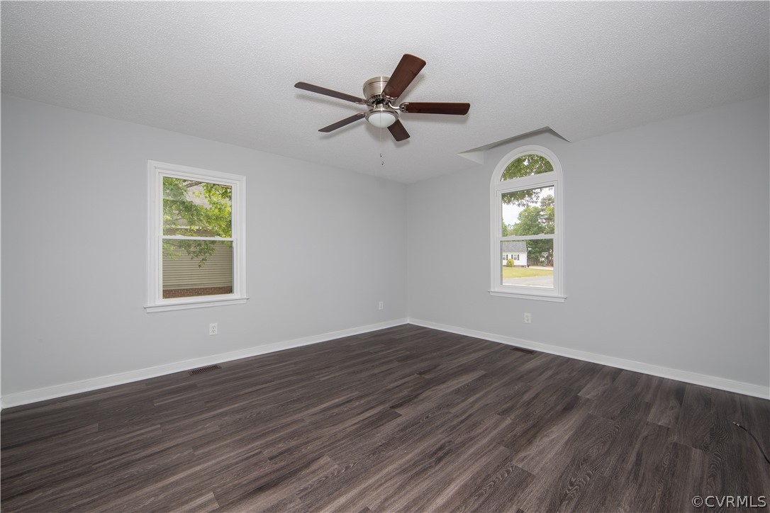 7344 Trailing Rock Road Prince George, VA 23875 - Photo 12 of 25 a view of empty room with wooden floor and fan