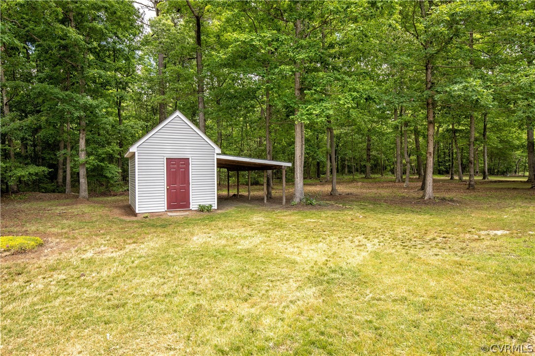 7344 Trailing Rock Road Prince George, VA 23875 - Photo 25 of 25 a view of a swimming pool with a house