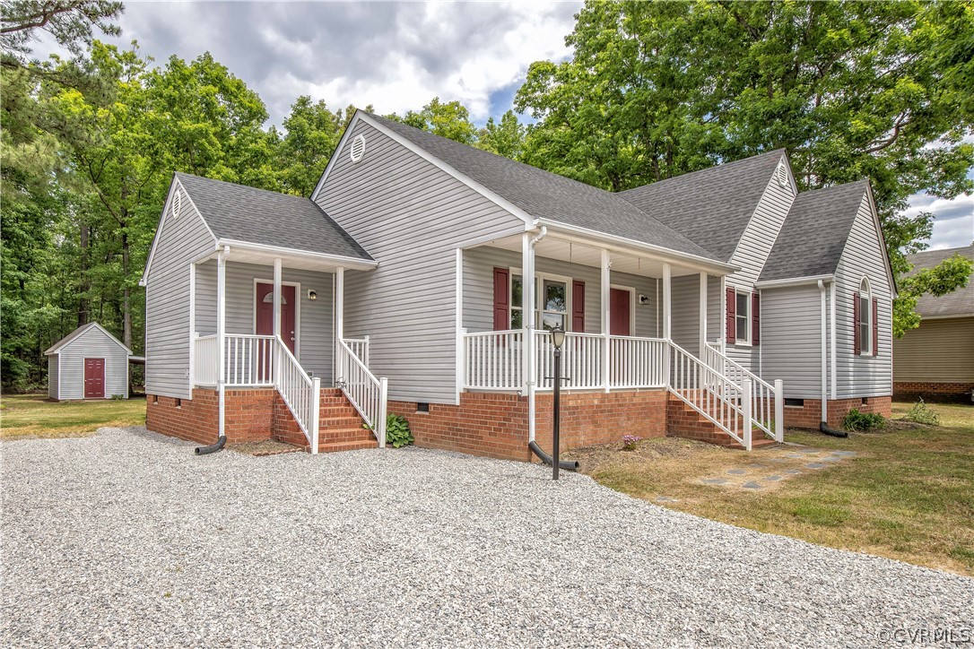 7344 Trailing Rock Road Prince George, VA 23875 - Photo 3 of 25 a view of a house with a yard and large tree