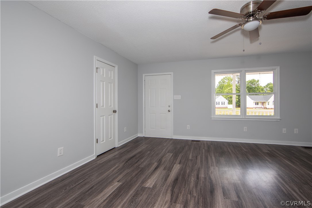 7344 Trailing Rock Road Prince George, VA 23875 - Photo 5 of 25 wooden floor in an empty room with a window