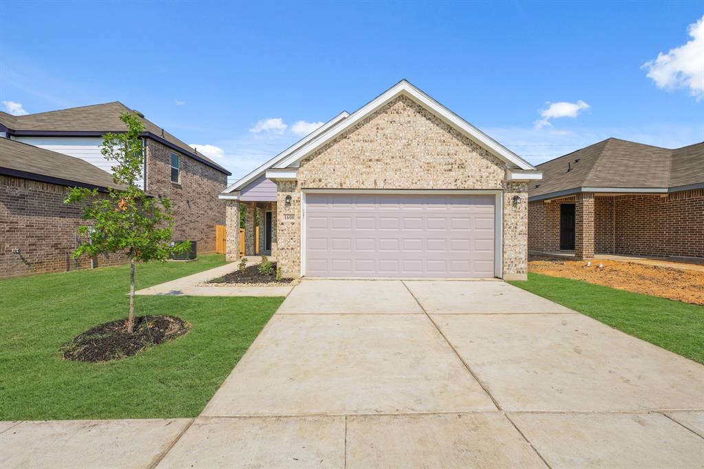 1600 Romans Road Ennis, TX 75119 - Photo 3 of 19 a front view of a house with garden