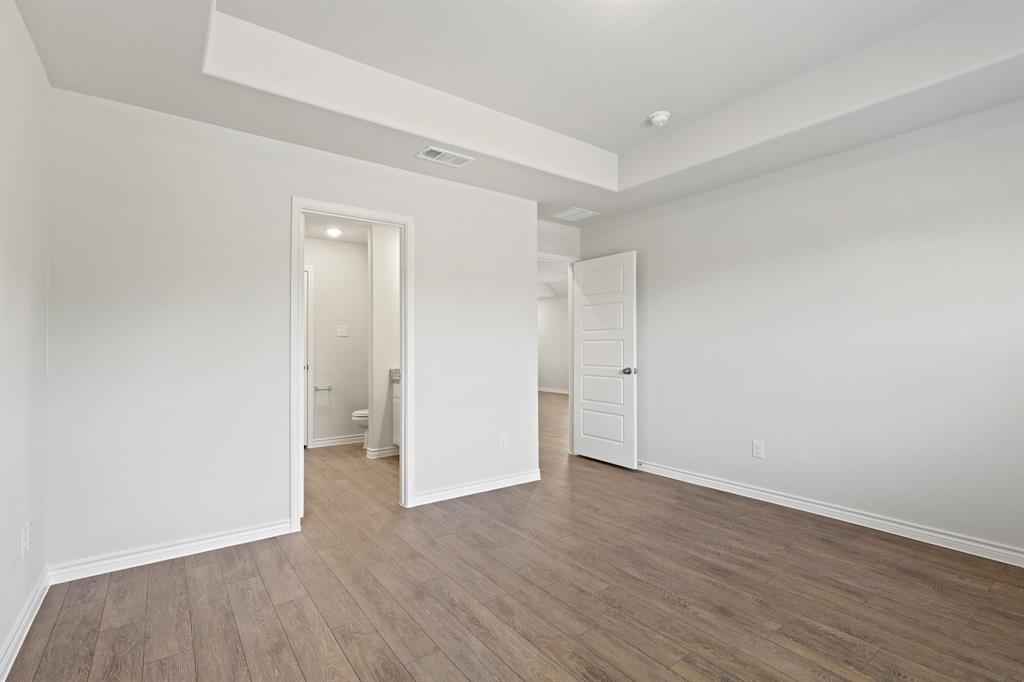 1600 Romans Road Ennis, TX 75119 - Photo 10 of 19 a view of an empty room with wooden floor