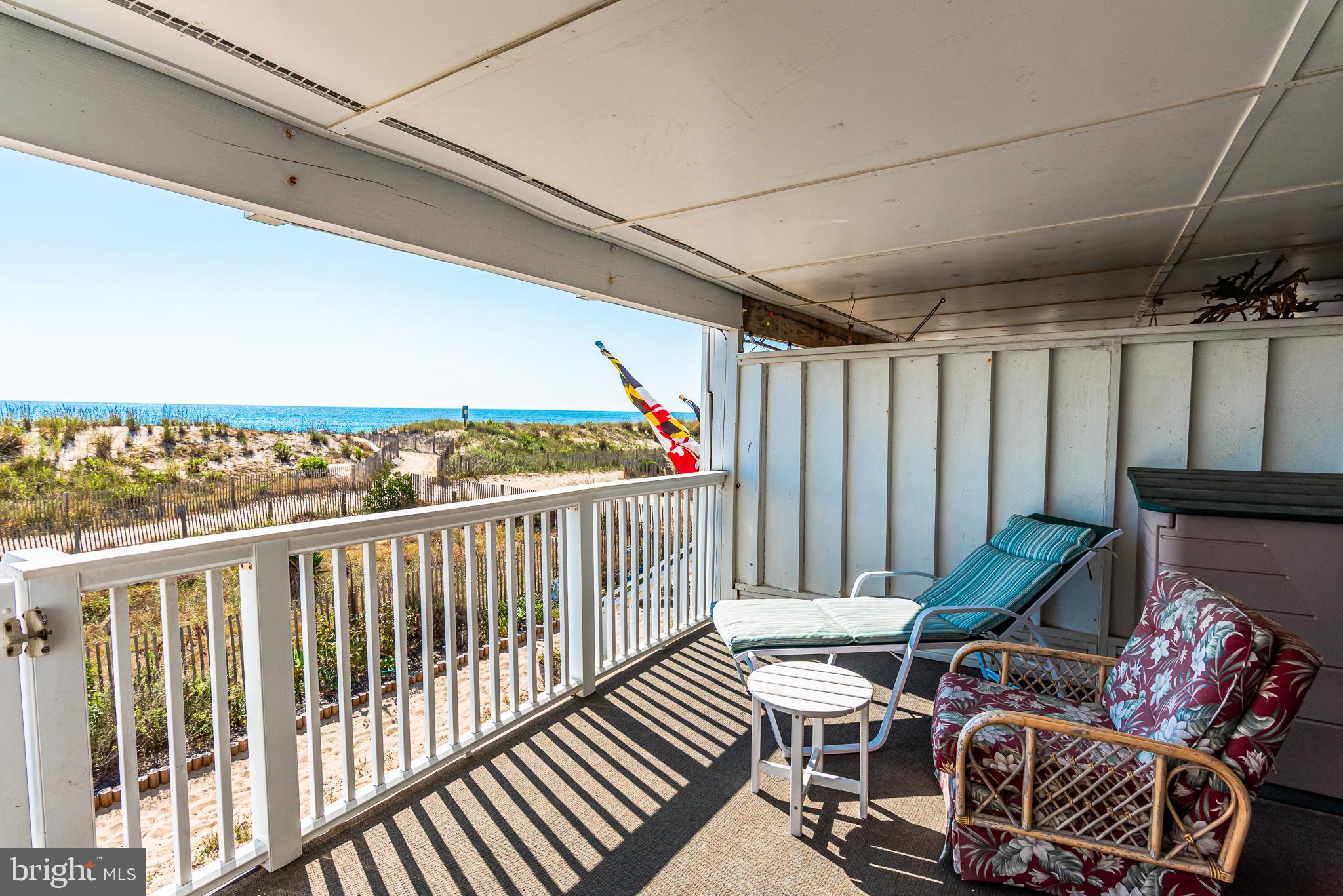 7601 Atlantic Avenue, Unit 3 Ocean City, MD 21842 - Photo 16 of 52 a balcony with chairs