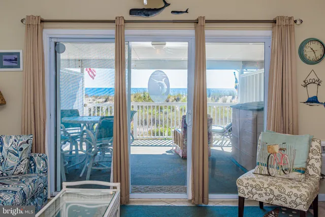 a living room with furniture a lamp and a window