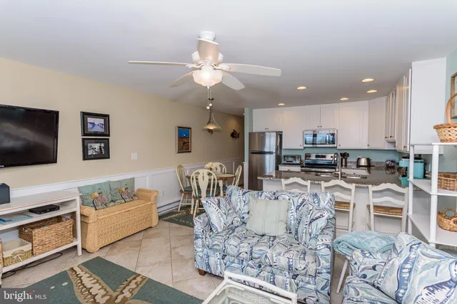 a large kitchen with a table and chairs
