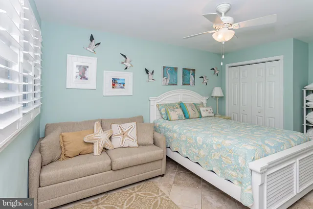 a bathroom with a toilet a sink and a shower curtain