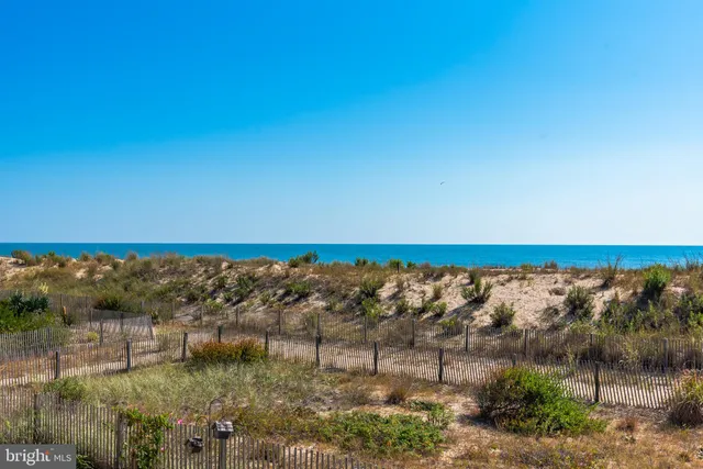 a view of a balcony with floor to ceiling windows