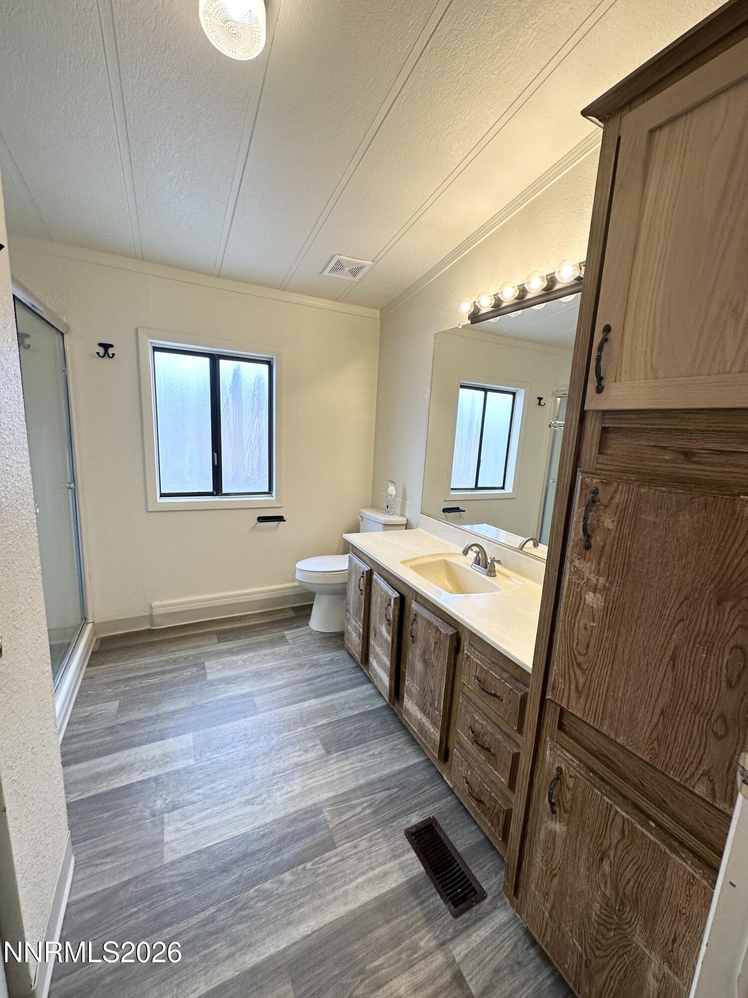 370 Randon Court Fernley, NV 89408 - Photo 11 of 15 a view of a bathroom with mirror on the wall