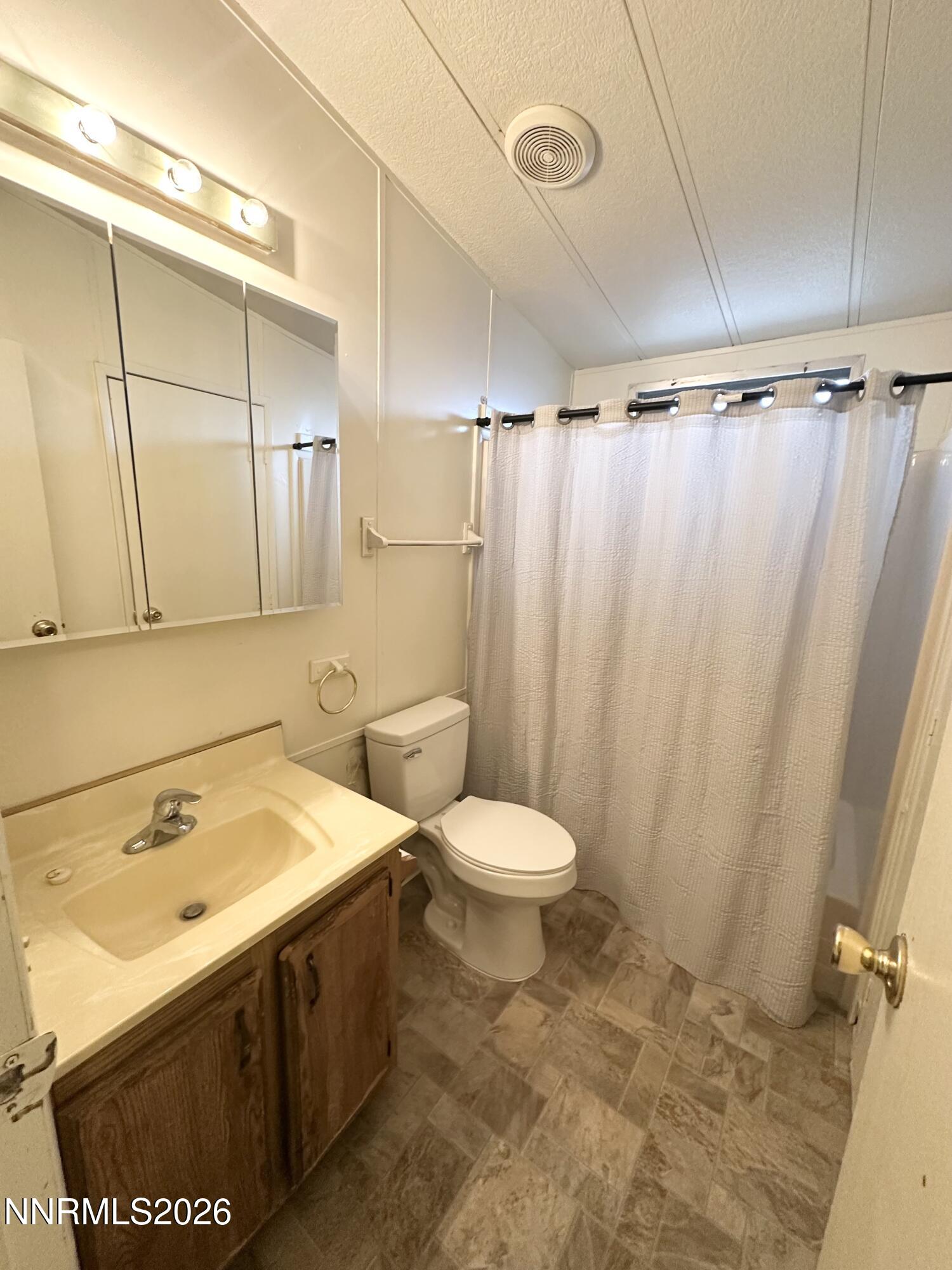 370 Randon Court Fernley, NV 89408 - Photo 12 of 15 a bathroom with a sink and a toilet
