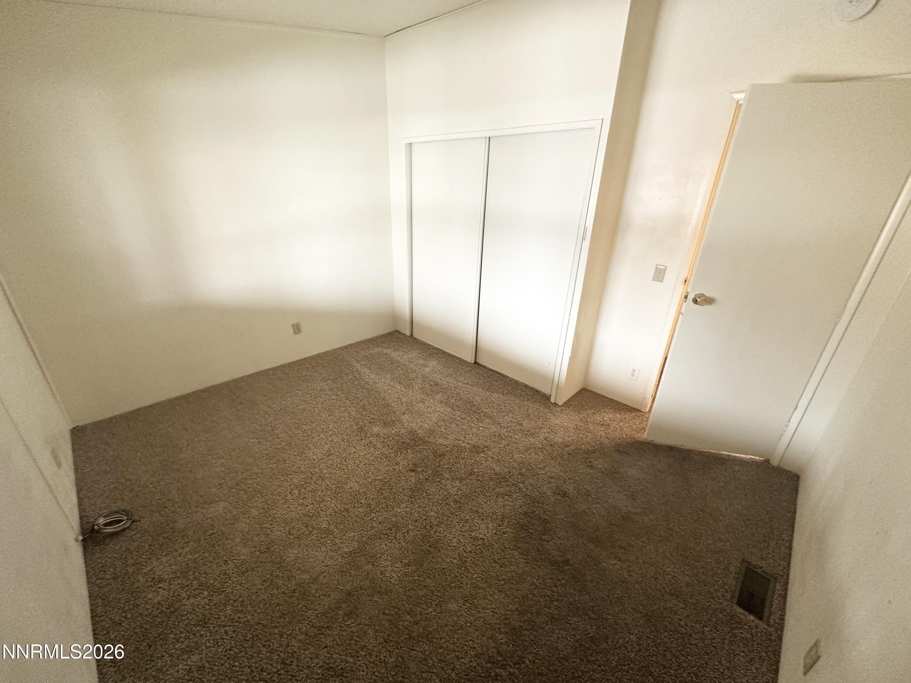 370 Randon Court Fernley, NV 89408 - Photo 9 of 15 an empty room with windows