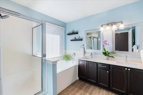 a bedroom with a bed and hallway