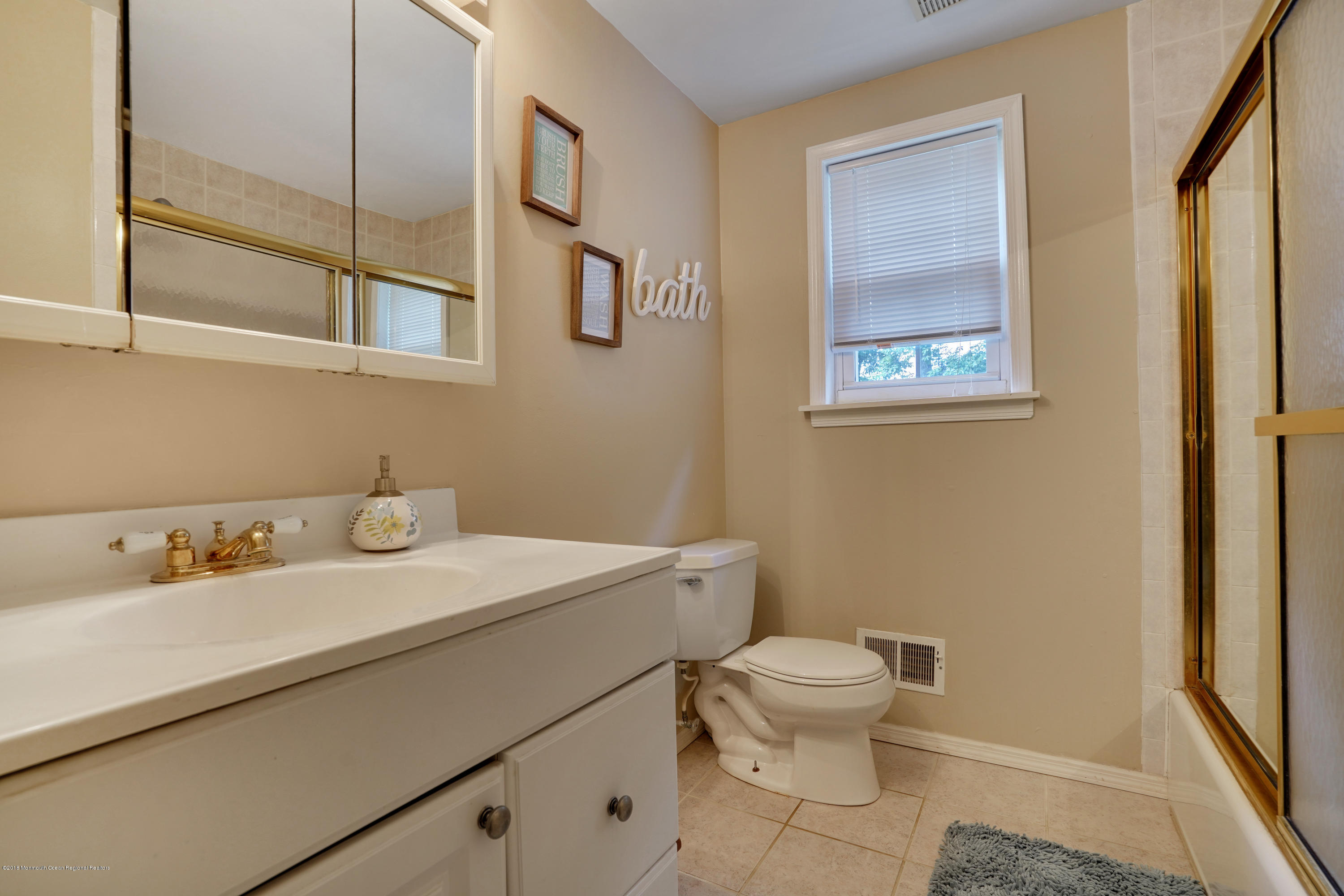 4 Ashford Road Jackson, NJ 08527 - Photo 31 of 44 a bathroom with a sink toilet and a mirror