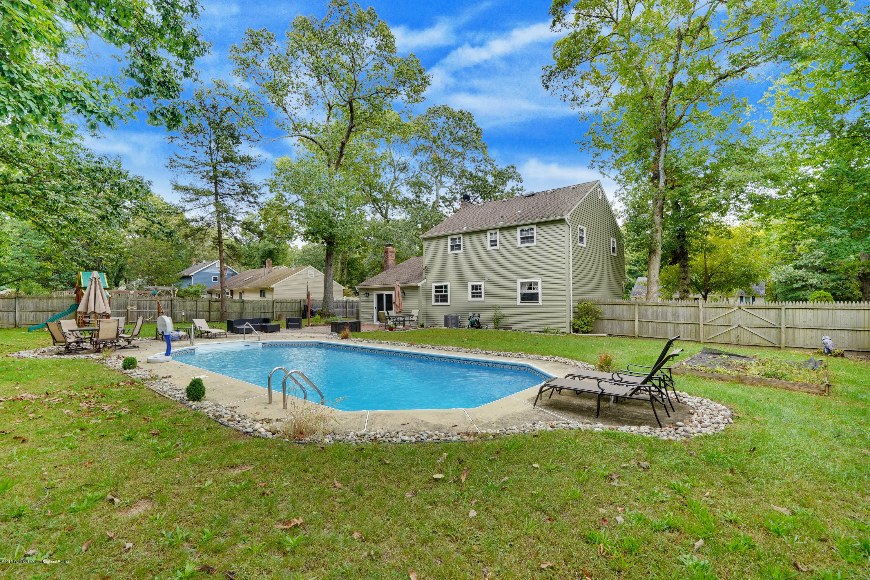 4 Ashford Road Jackson, NJ 08527 - Photo 38 of 44 a swimming pool with outdoor seating and yard