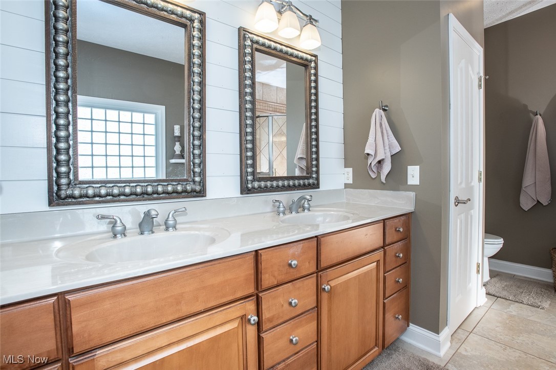 632 Rundle Street Lagrange, OH 44050 - Photo 14 of 30 Full bath with double vanity and light tile patterned floors