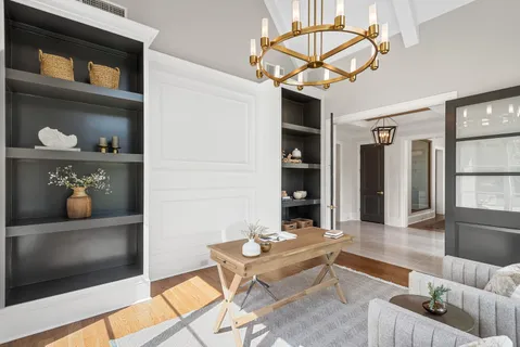 a view of a kitchen with a sink and windows