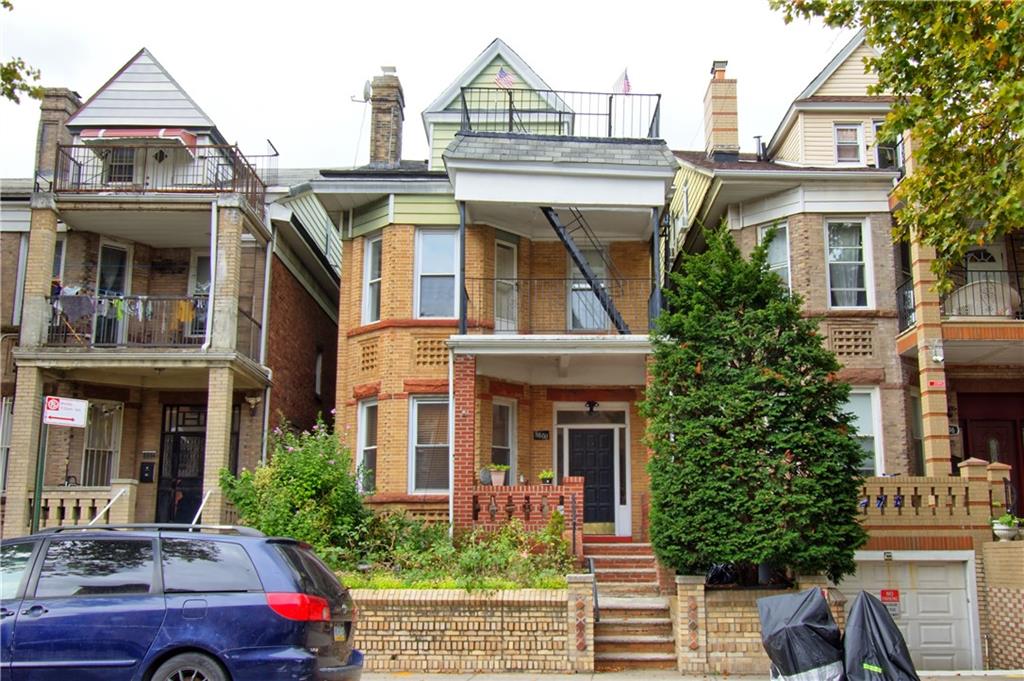 a front view of a house with trees
