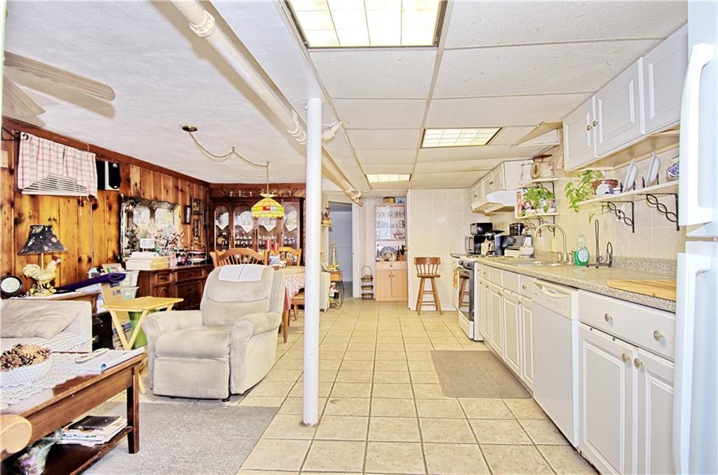 8800 19th Avenue Brooklyn, NY 11214 - Photo 16 of 26 a large white kitchen with a large window