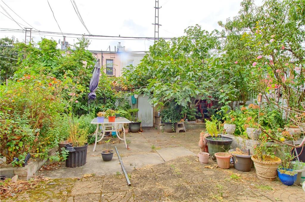 8800 19th Avenue Brooklyn, NY 11214 - Photo 20 of 26 a view of a chairs and table in backyard