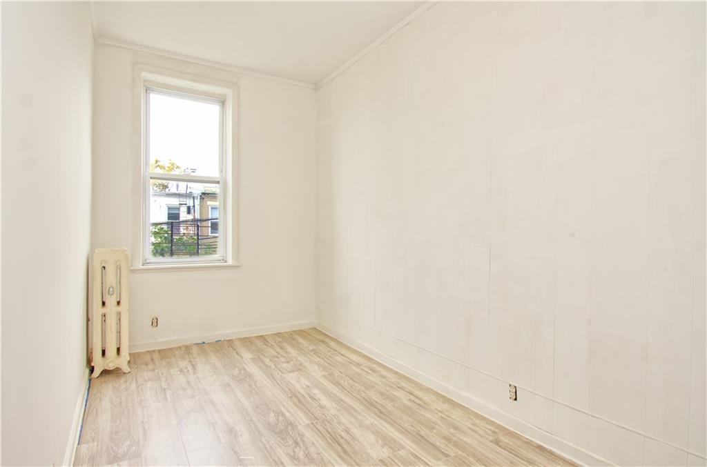 8800 19th Avenue Brooklyn, NY 11214 - Photo 4 of 26 a view of a room that has a window in it