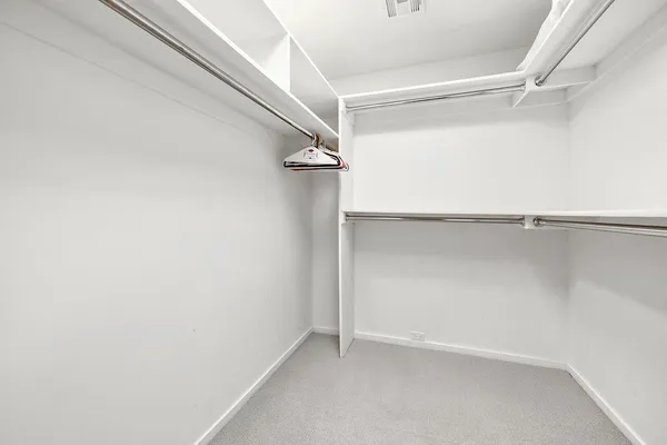 a view of an empty walk in closet