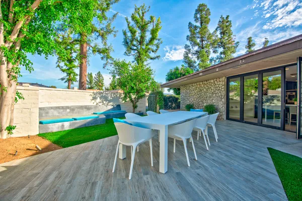 a dining room with furniture and wooden floor