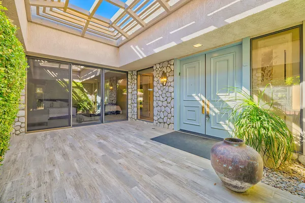 a view of an entryway with hardwood floor