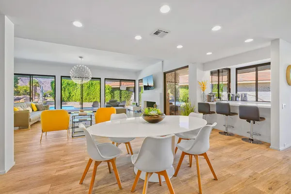 a view of a dining room with furniture window and wooden floor
