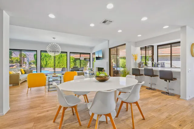 a view of a dining room with furniture window and wooden floor