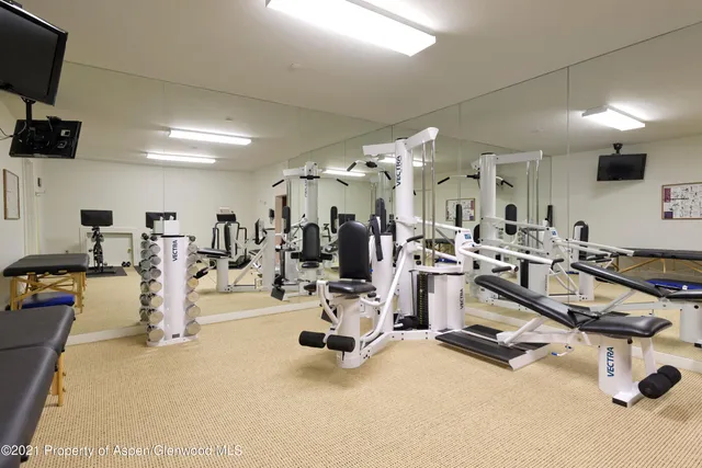 a view of a room with gym equipment