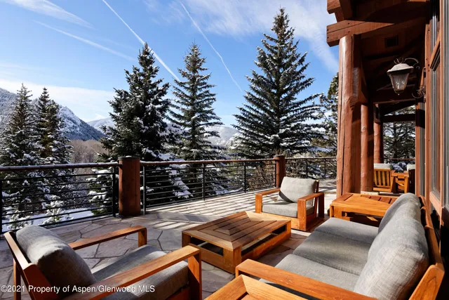 a view of a balcony with chairs