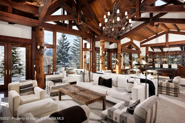 a very nice looking living room with furniture and a large window