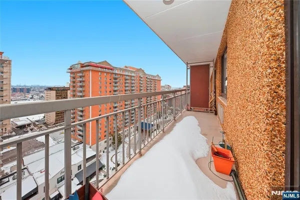 a view of balcony with furniture
