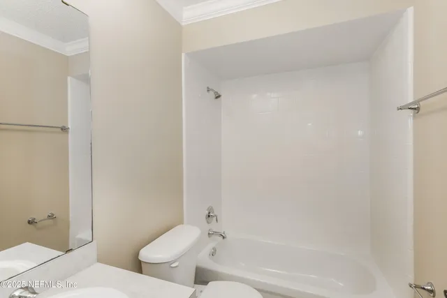 a bathroom with a toilet and a bathtub