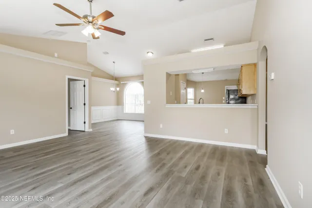 a view of a kitchen with a sink and a window