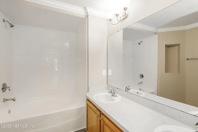 a bathroom with a bathtub and a sink