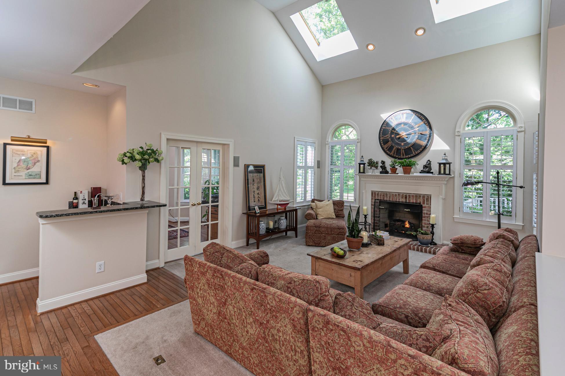 173 Christopher Drive Princeton, NJ 08540 - Photo 25 of 51 Family Room with fireplace and plantation shutters