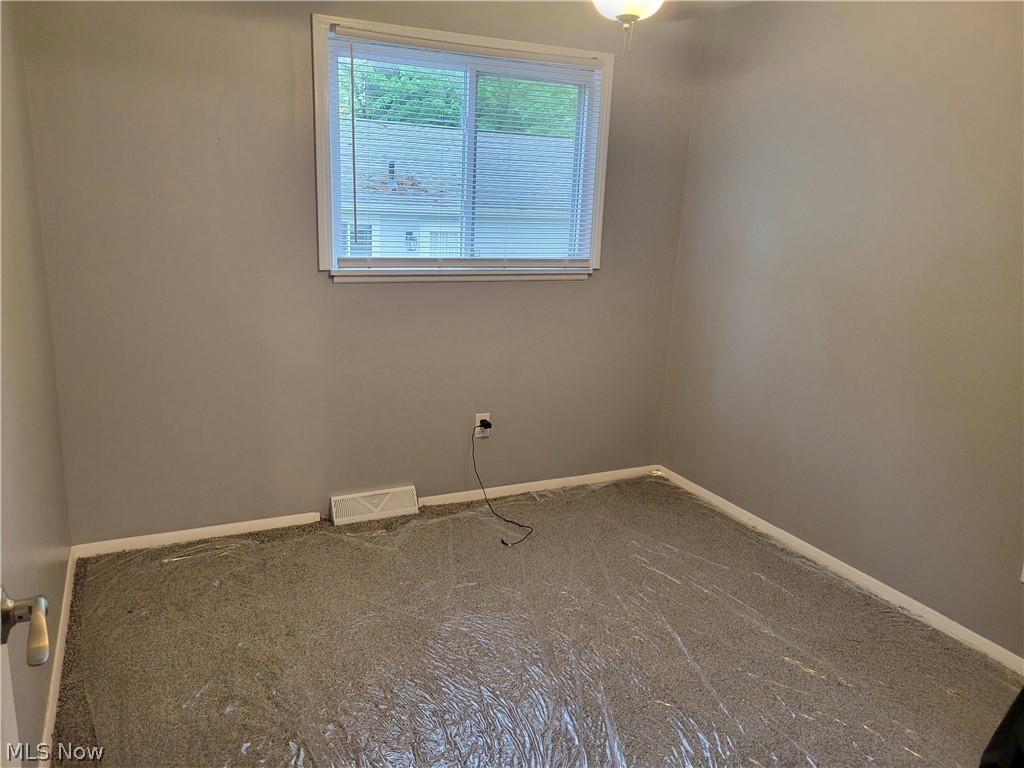 4895 Lear Nagle Road North Ridgeville, OH 44039 - Photo 16 of 27 View of carpeted empty room